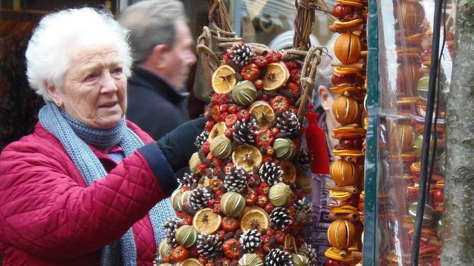 Lady looking at decorations