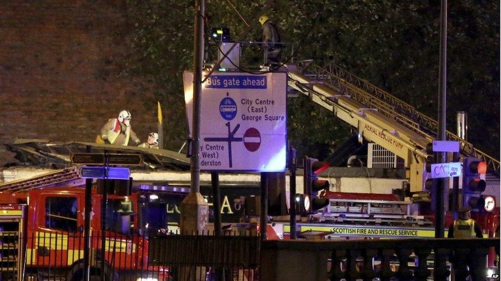 Firefighters at Glasgow pub helicopter crash scene