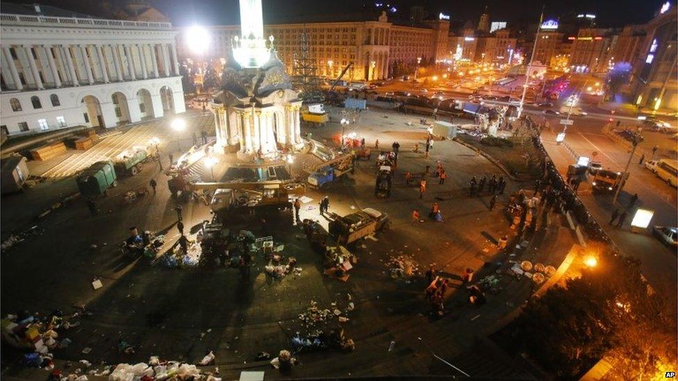 Workers clean the Independence Square.