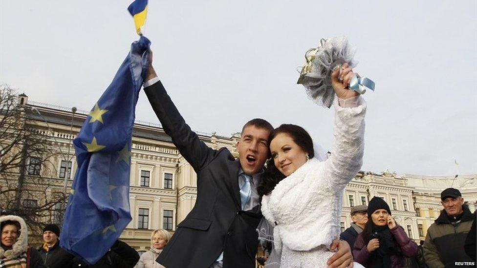 Newlyweds attend a rally held by supporters of EU integration in Kiev.
