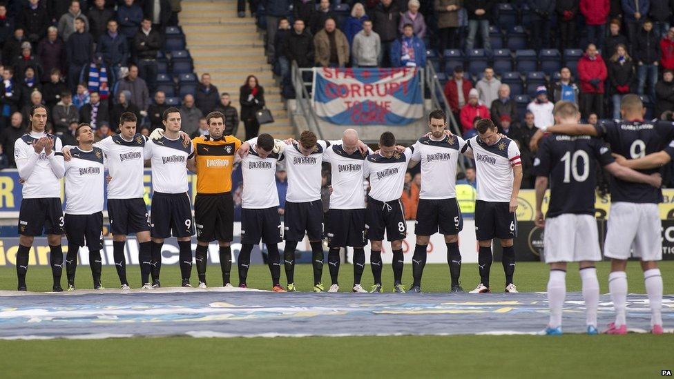 Rangers and Falkirk players observe a minutes silence for the victims of the helicopter crash, before the Fourth Round William Hill Scottish Cup match at Falkirk Stadium