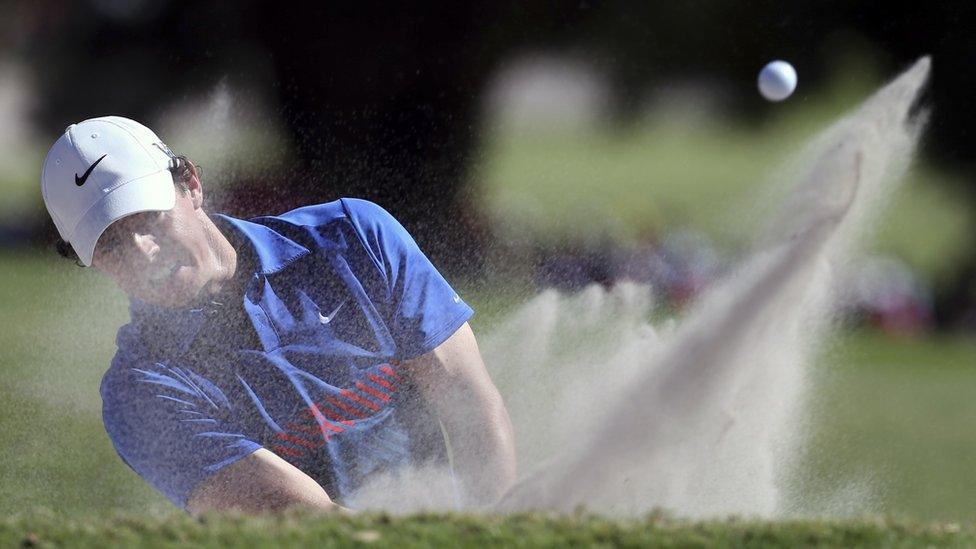 World number six Rory McIlroy plays a bunker shot at the 16th hole during the final day of the Australian Open in Sydney