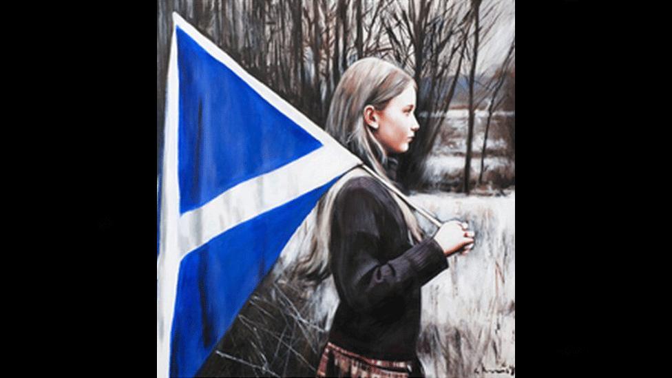 A girl looking out across a wintry landscape, carrying a Saltire.