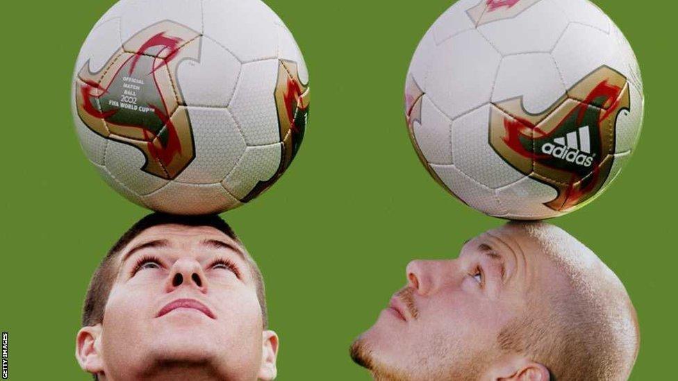 England captain David Beckham and team-mate Steven Gerrard with the Adidas Fevernova ball used in the 2002 World Cup in Japan and South Korea.