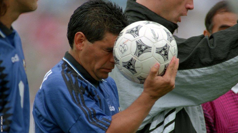 Argentina's Diego Maradona with the Questra, the official match ball of the 1994 World Cup in the United States.