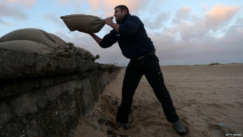 Man lifting sandbags