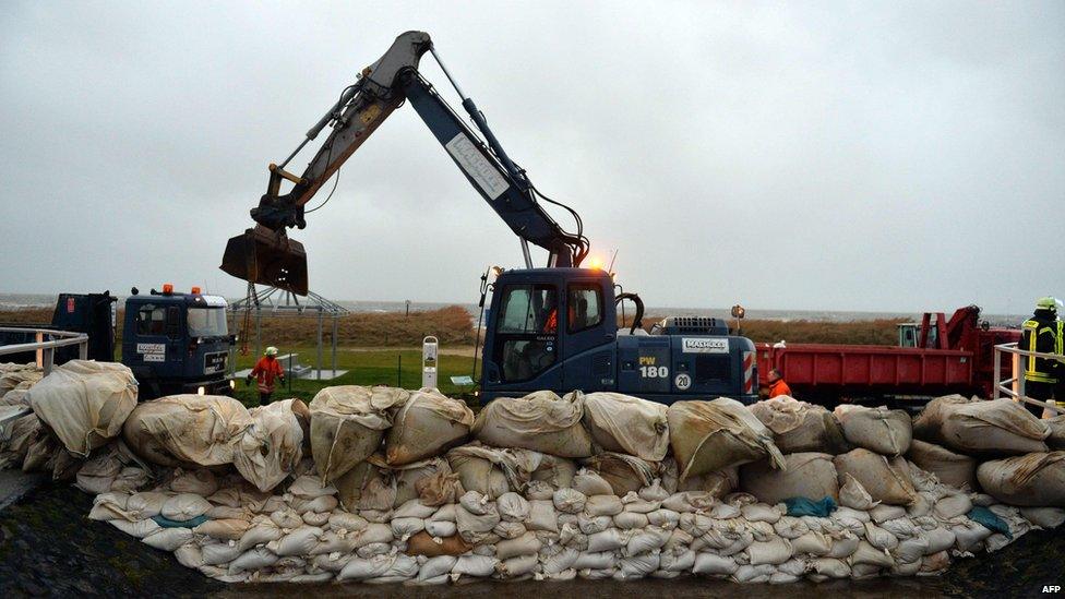 Embankment in Cuxhaven-Sahlenburg, northern Germany being reinforced against flooding (5 Dec)