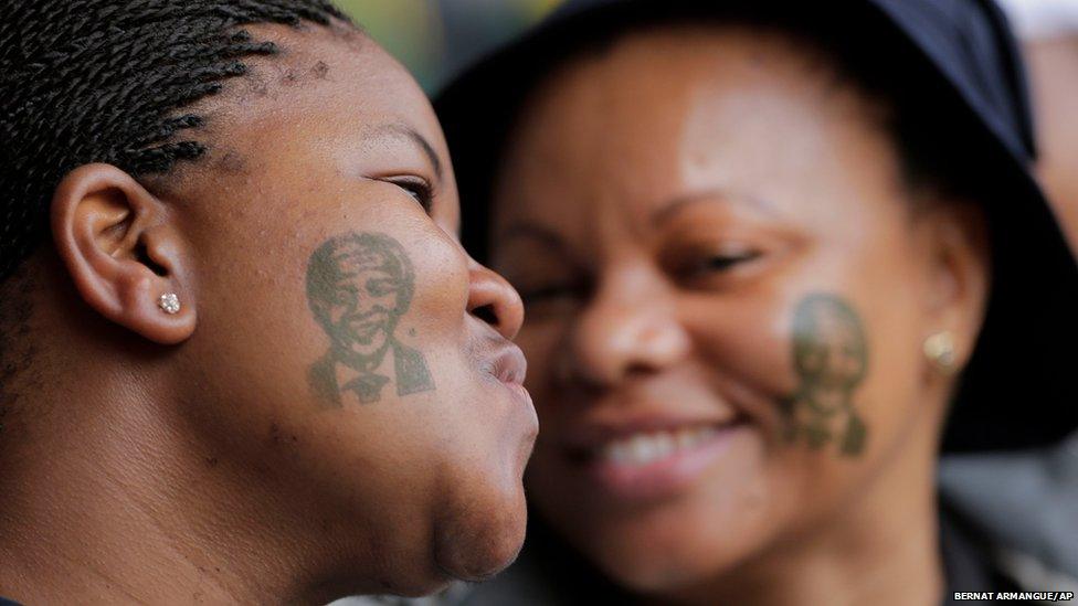 Women with tattoos of former South African president Nelson Mandela