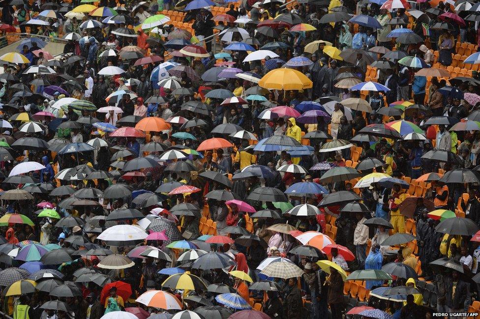 People holding umbrellas