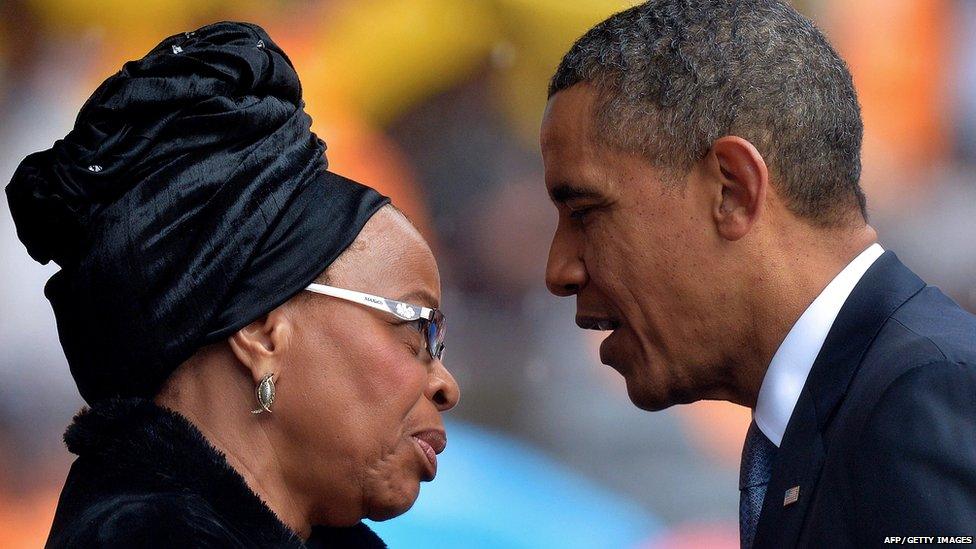 President Barack Obama greets Nelson Mandela's wife, Graca Machel.