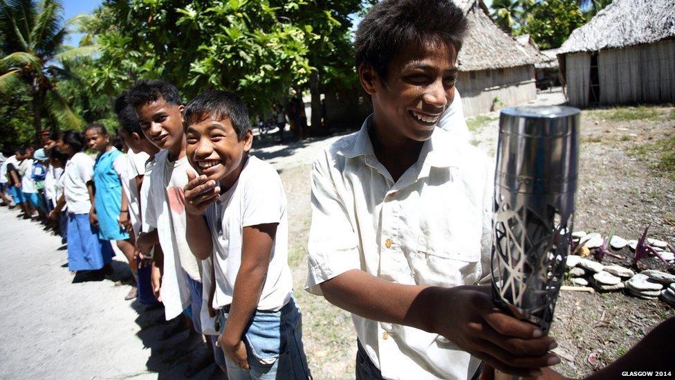 Students from Uekera Primary School in Kiribati wait patiently for their turn to hold the Queen's baton during the celebrations in Kiribati.