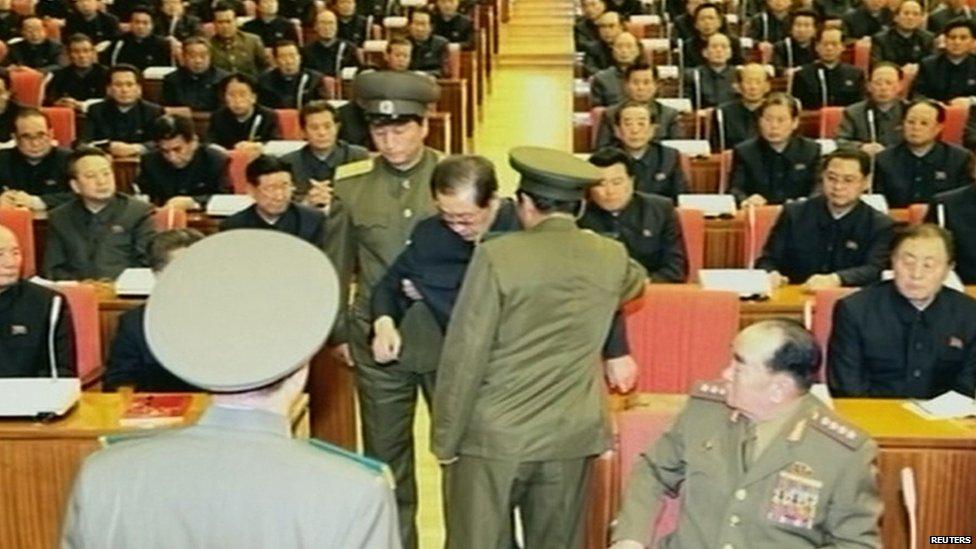 A still image taken from North Korea's state-run KRT TV on 9 December 2013 shows Chang Song-thaek being forcibly removed by uniformed personnel from a Communist Party meeting in Pyongyang