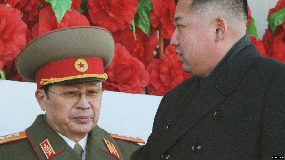 North Korean leader Kim Jong-un (R), flanked by his uncle North Korean Chang Song-thaek, leaves a military parade to mark the birth anniversary of the North's late leader Kim Jong-il in Pyongyang on 16 February 2012