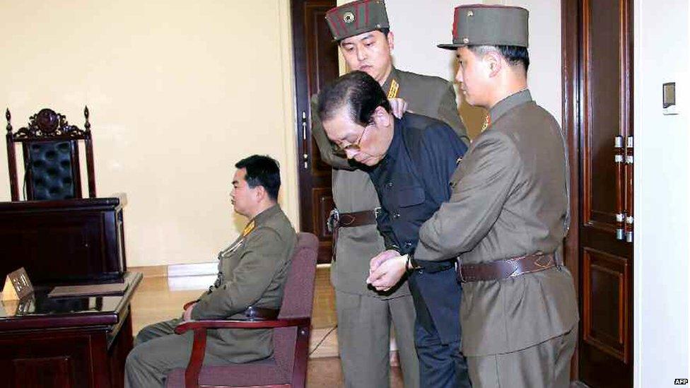 A photo showing Chang Song-thaek (second right) being escorted in court on 12 December 2013