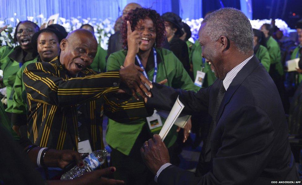 Former South African President Mbeki is greeted by ANC supporters