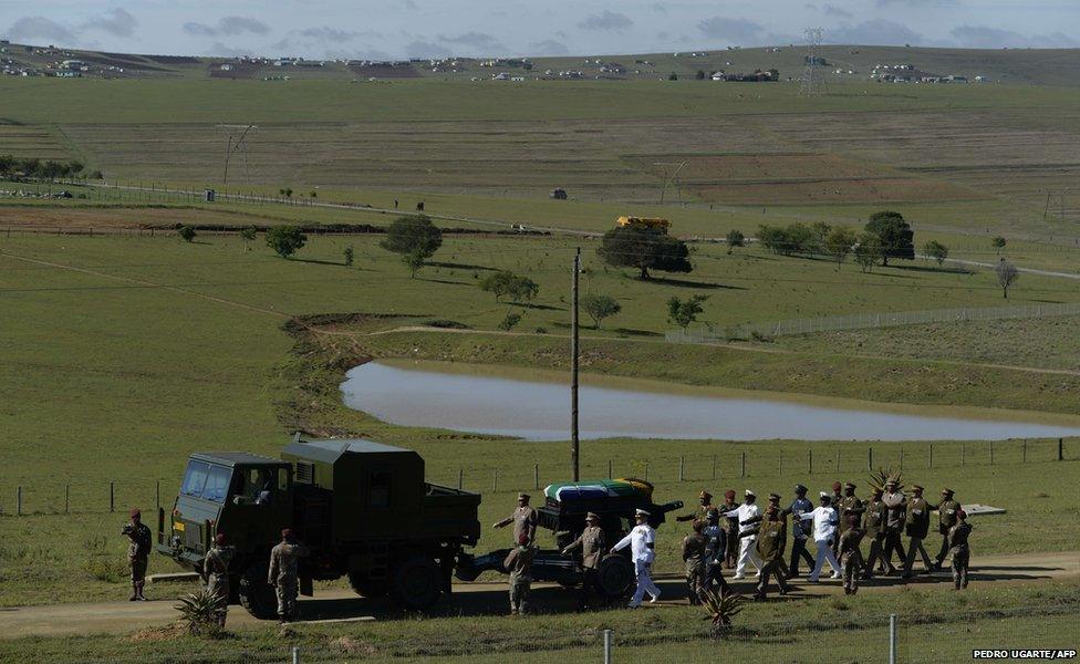 The coffin arrived with a military escort