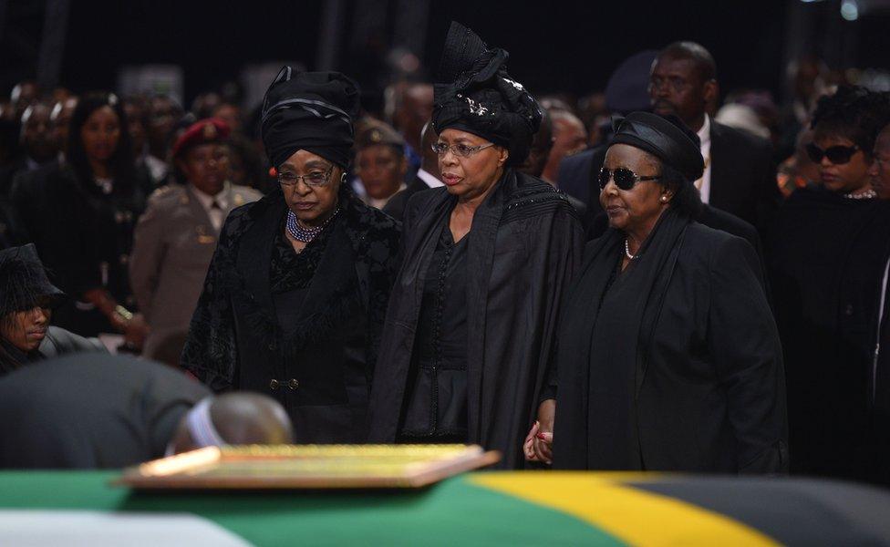 The ex-wife of Nelson Mandela, Winnie Mandela Madikizela (left), and the widow of Nelson Mandela, Graca Machel (centre)