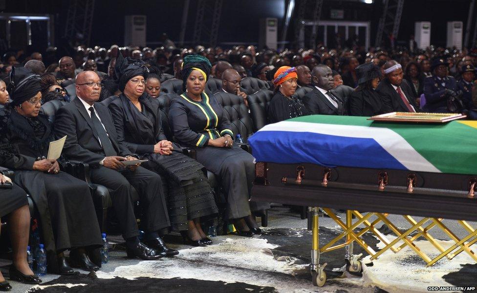 South African President Jacob Zuma sits between Winnie Madikizela-Mandela (left) and Graca Machel