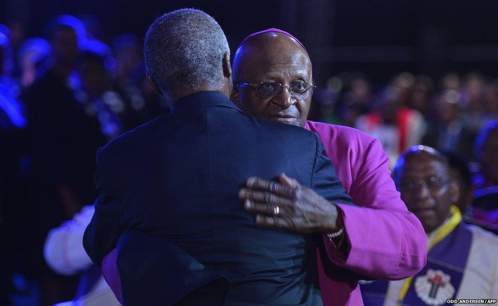 South Africa"s archbishop emeritus Desmond Tutu (R) and former South African President Thabo Mbeki greet each