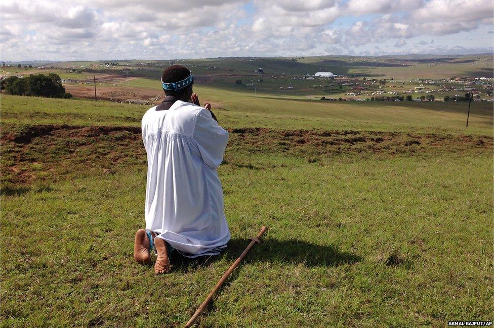 Shembe priest Michael Notychanga prayed in the direction of the home of former Mr Mandela