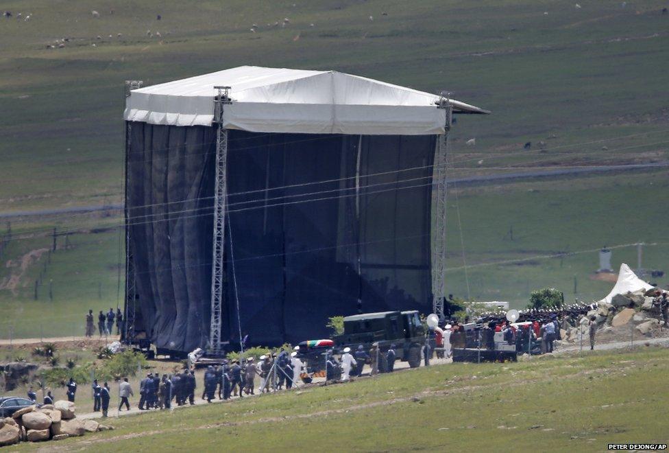 The coffin is carried on a gun carriage