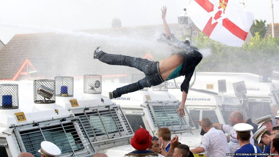 Protestor hit by water cannon