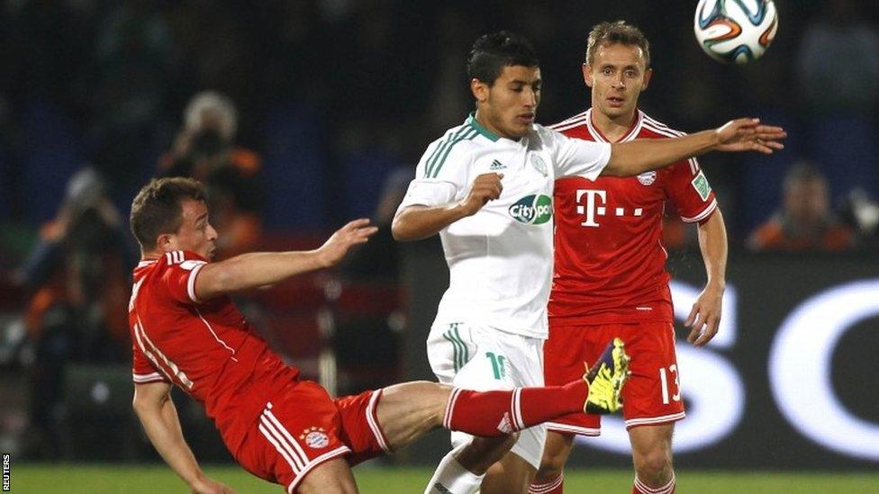 Abdelilah Hafidi (centre) of Morocco's Raja Casablanca fights for the ball with Xherdan Shaqiri (left) of Germany's Bayern Munich during the Fifa Club World Cup final