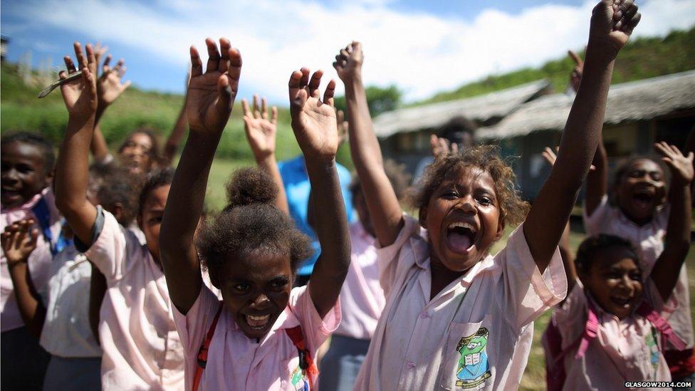 Local school girls cheer excitedly as the Queen's Baton arrives in their school in Honiara, Solomon Islands.