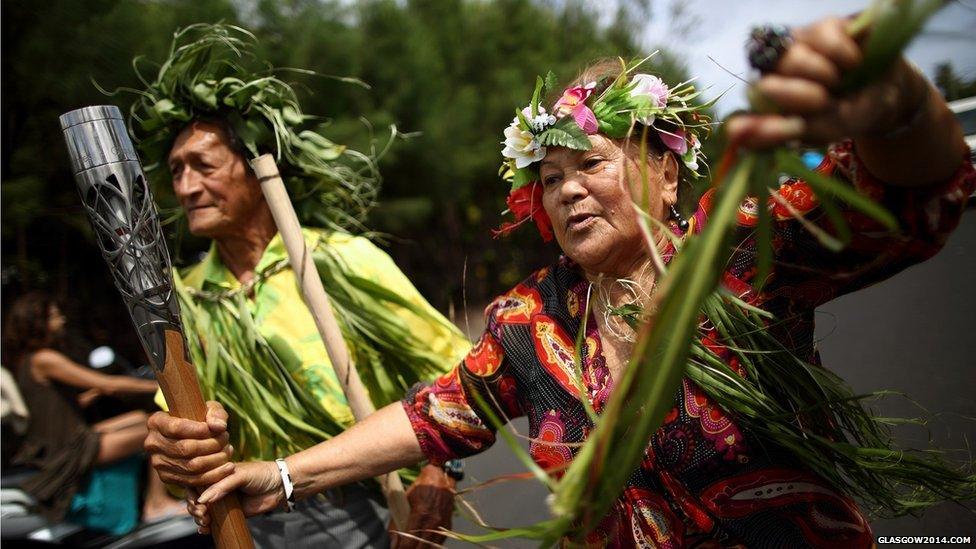 Local elders carry the Queen's baton in Rarotonga, Cook Islands.