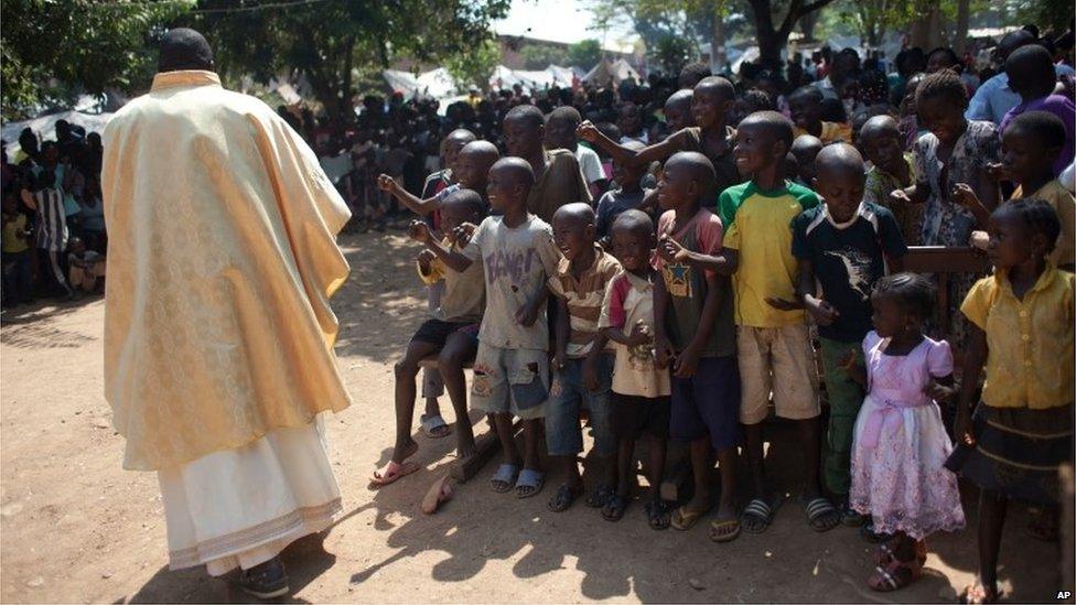 Catholic priests lead a special Christmas Day mass in Bangui, Central African Republic on 25 December, 2013