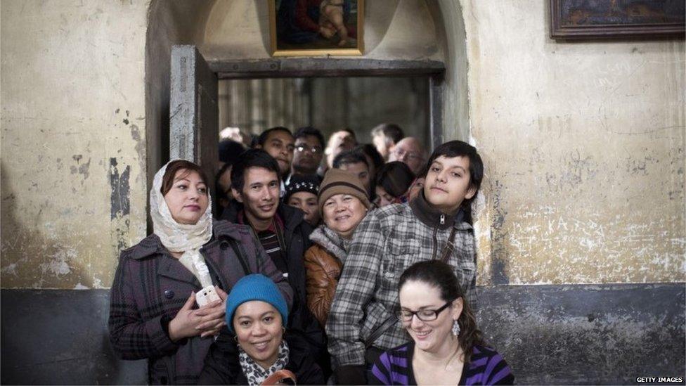 Christian worshippers at the Church of the Nativity in Bethlehem, West Bank, 25 Dec