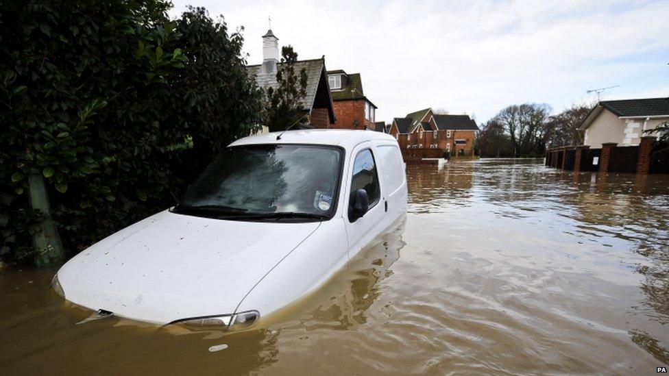 A car submerged near Iford Bridge Home Park