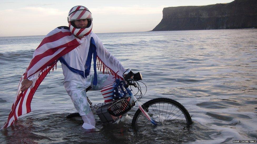 Man on a bike in the sea