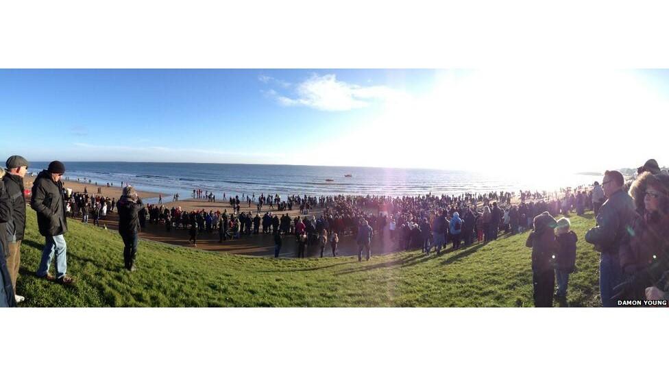 People watching the dip at Seaburn