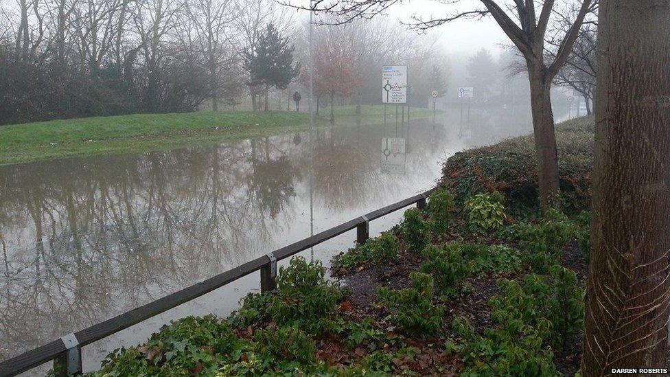 The River Wey has burst its banks.