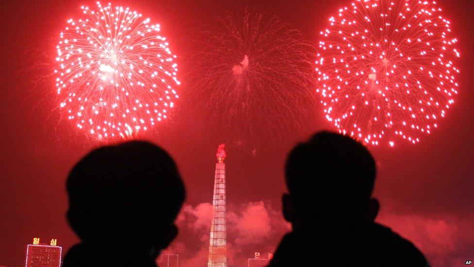 Fireworks explode over Juche Tower and the Taedong River in Pyongyang, North Korea.