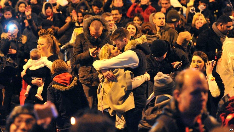 A couple kiss during New Year celebrations in London