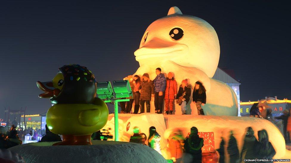 A snow sculpture of a giant rubber duck