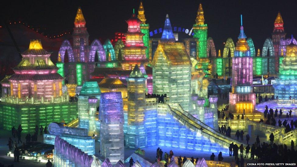 A city made of ice, illuminated in a rainbow of colours