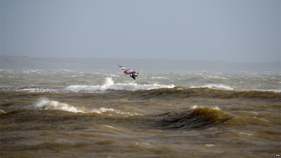 Windsurfers taking advantage of the weather at Mudeford in Dorset