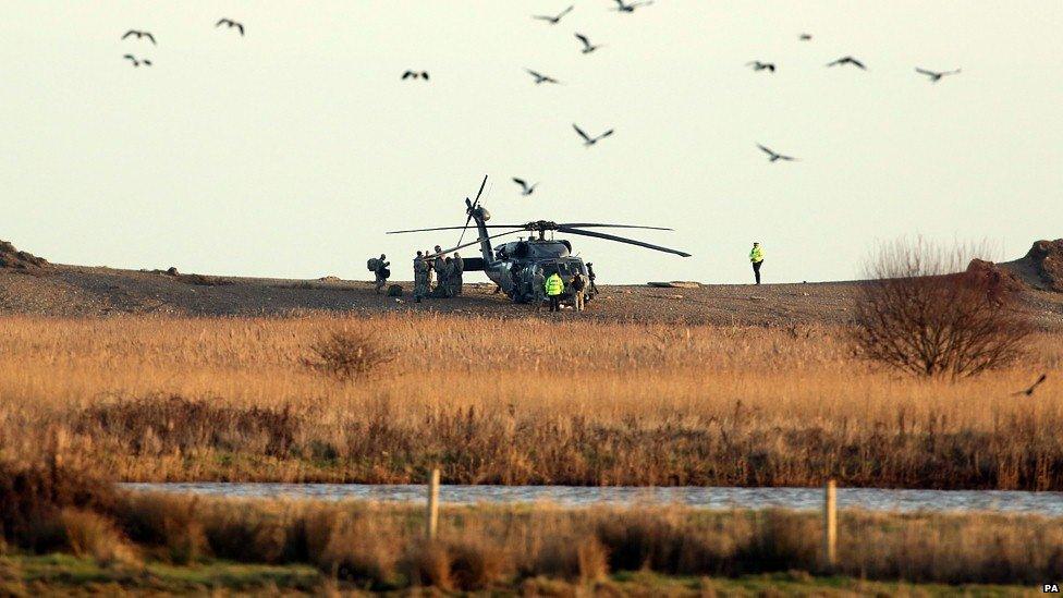 A US military helicopter near the scene at Salthouse in Norfolk following the crash of a US Air Force HH-60G Pave Hawk helicopter during a training exercise