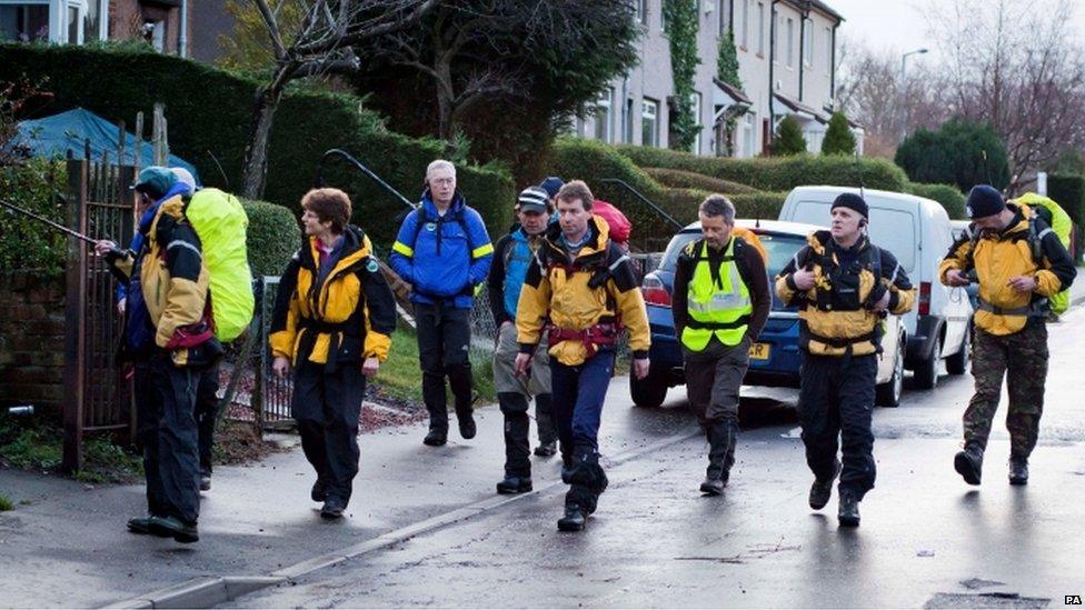 Members of a mountain rescue team join search