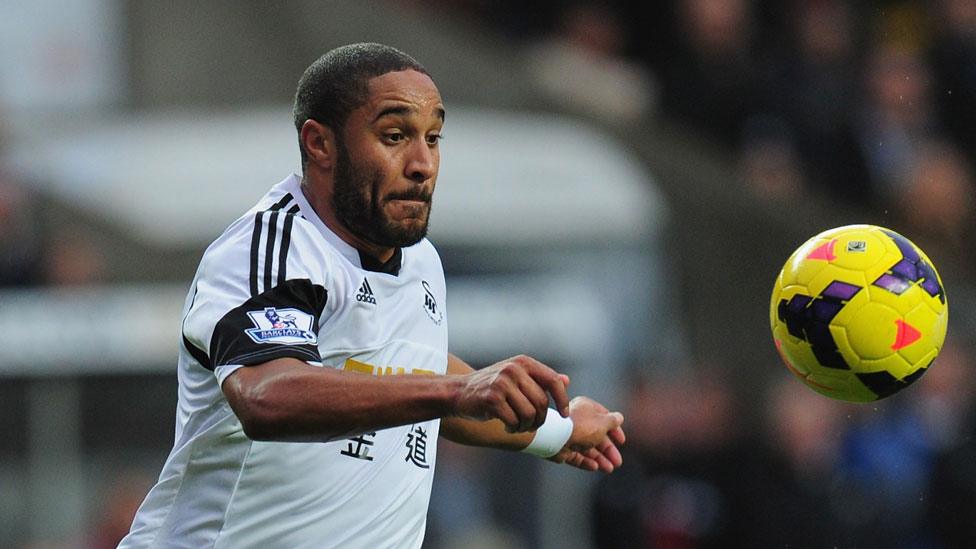 Ashley Williams of Swansea City prepares to clear the ball