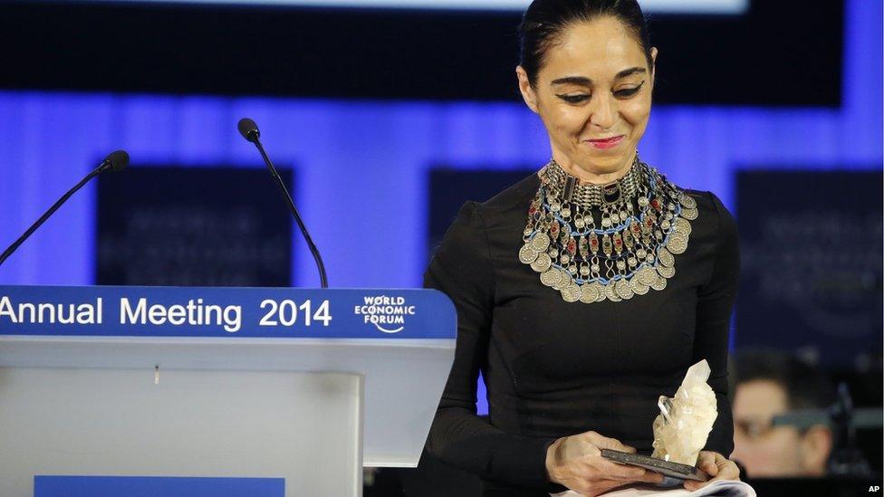 Artist Shirin Neshat holds the Crystal award