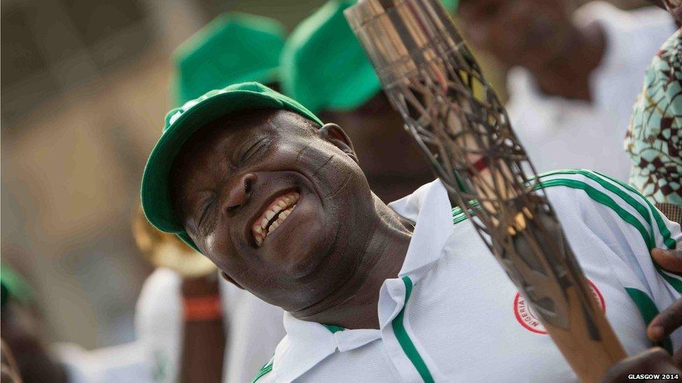 Dr Ro Oladipo the President General of the Nigerian Sports Supports Union holds the Queen's baton during celebrations in Lagos, Nigeria.