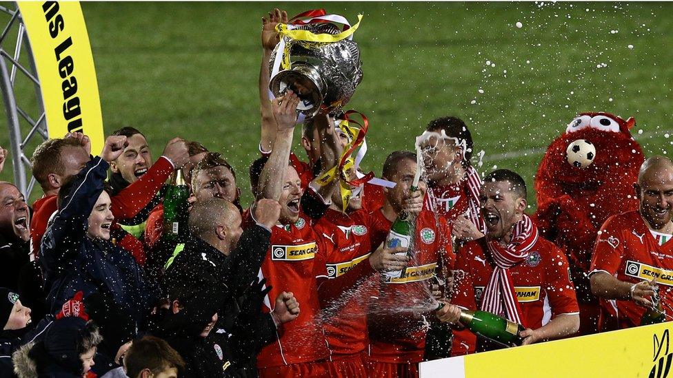 It's a champagne moment for Cliftonville as they lift the League Cup for a second year in a row