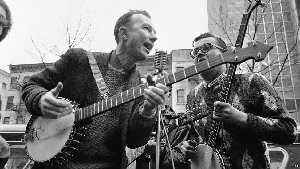 Seeger, left, performing at the Rally for detente at Carnegie Hall in New York in May 1975