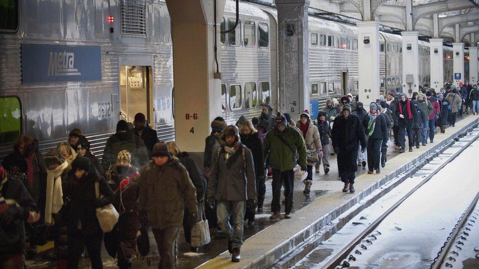 People walking through train station in Chicago.