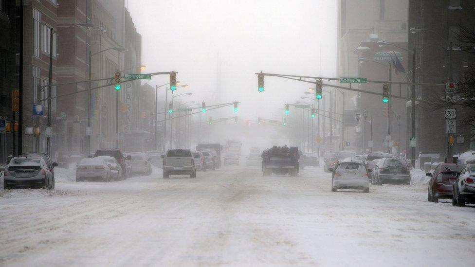 Cars on snow covered road