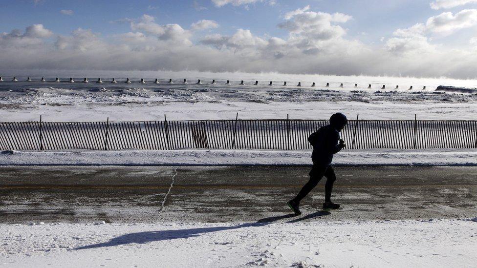 Person running by Lake Michigan in Chicago.